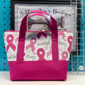 Mini Tote Makeup Bag made in a breast cancer awareness fabric
