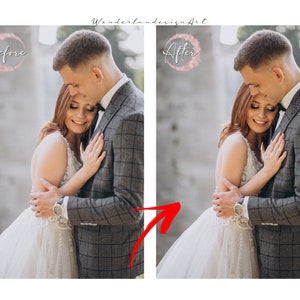 May include: A couple poses for a wedding photo. The bride is wearing a white wedding dress and the groom is wearing a gray suit. The couple is standing in front of a stone wall.