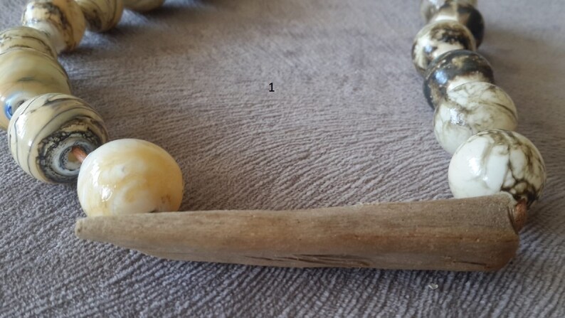 handmade glass hollow /& a piece of wood grown and aged in the sea .whenever you wear feel this sea water nature and flames .Feel the life