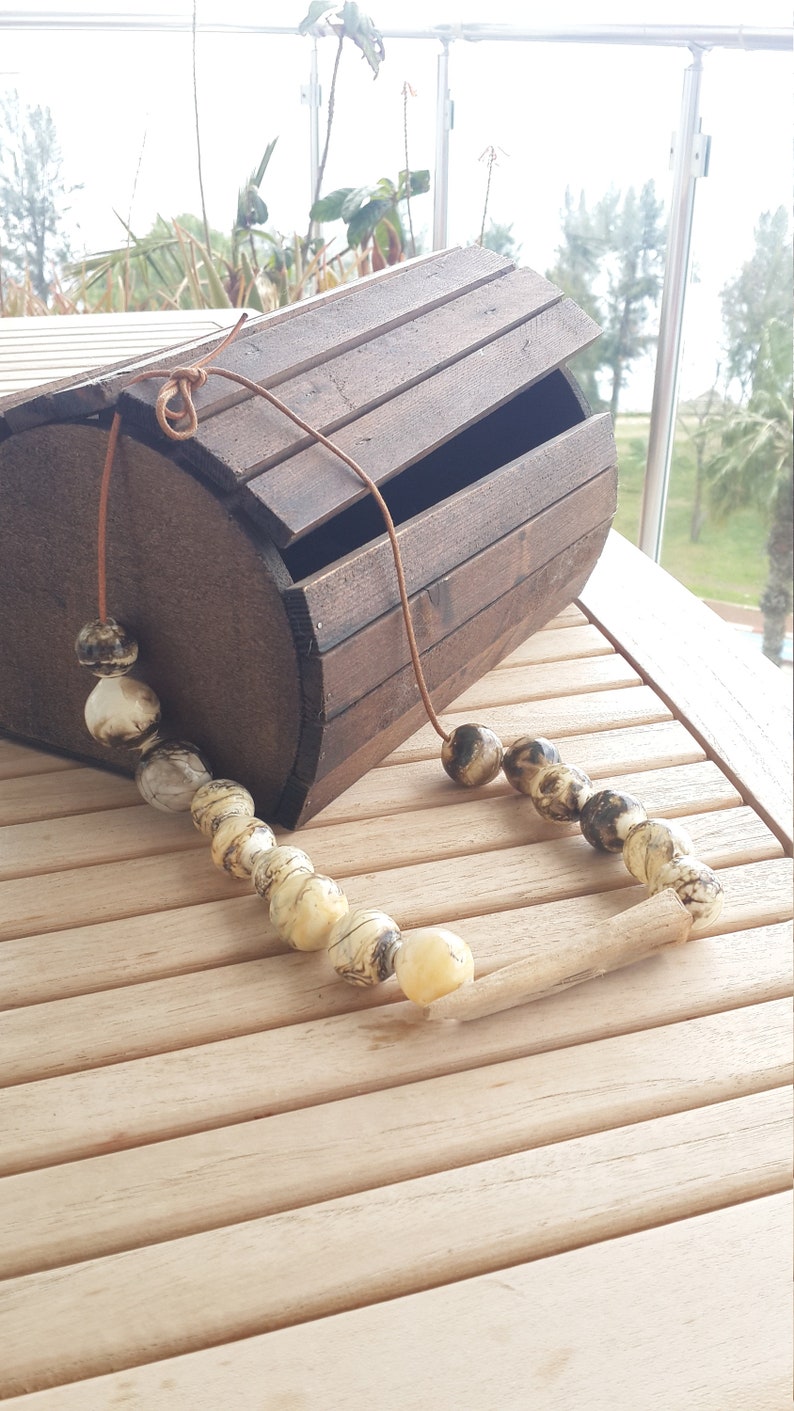 handmade glass hollow /& a piece of wood grown and aged in the sea .whenever you wear feel this sea water nature and flames .Feel the life