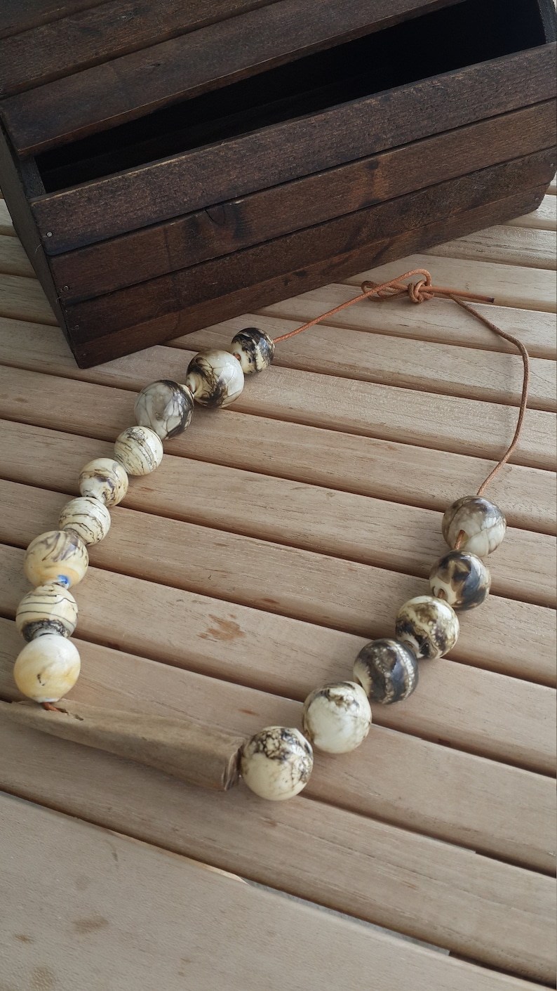handmade glass hollow /& a piece of wood grown and aged in the sea .whenever you wear feel this sea water nature and flames .Feel the life