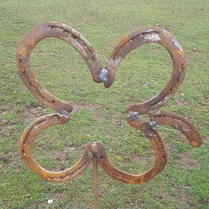 Lucky clover plugs made from old horseshoes