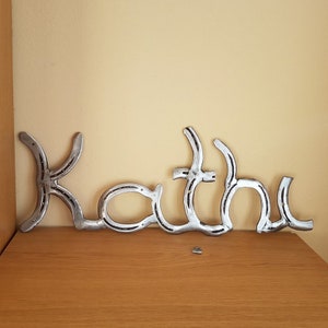Individual lettering made from old horseshoes gift idea