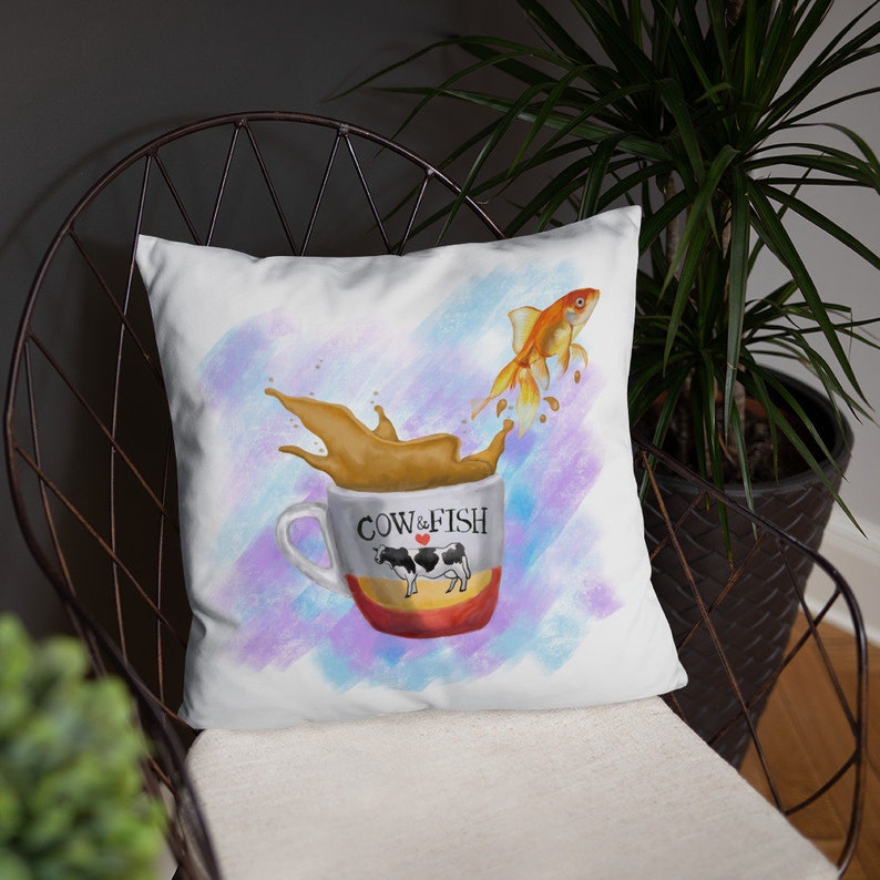 Goldfish jumping from a cup of milk tea Basic Pillow image 4