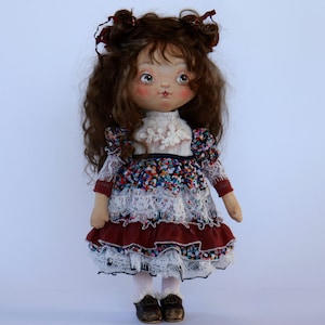 handmade textile doll made of fabric. natural hair from goat wool. face painted with acrylic paints made in retro style