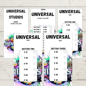 May include: Several white cards with the text "UNIVERSAL" and "SAVINGS CHALLENGE". The cards feature various amounts and sections, with colorful graphics of characters. The cards are designed for tracking savings.