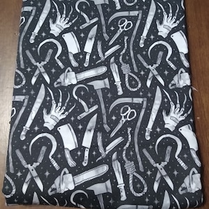 Grey and White Horror Movie Weapons Black Background Padded Book Sleeve with Closure