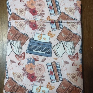 Typewriter Books Flowers Butterfly Light Pink Background Padded Book Sleeve with Closure
