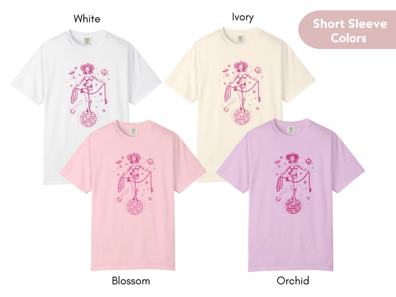May include: Four short-sleeve t-shirts in white, ivory, blossom pink, and orchid purple. Each shirt features a pink graphic of a cowgirl on a disco ball with the text "Keep on Dancing".