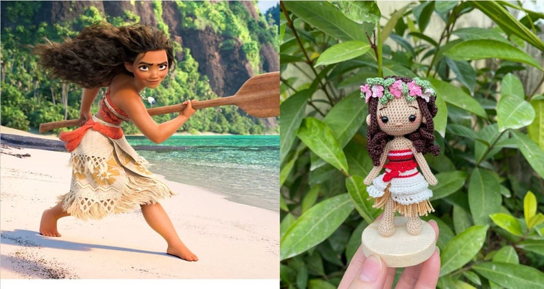 May include: A crocheted doll of Moana from the Disney film Moana. The doll is wearing a red and white top, a white skirt, and a flower crown. The doll is standing on a wooden base.