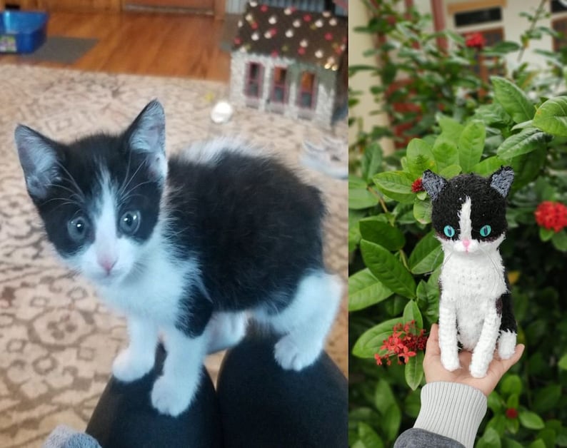 May include: A black and white kitten with blue eyes sits on a person's lap. A crocheted black and white kitten with blue eyes sits in a person's hand.