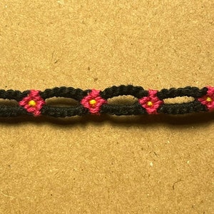 Handmade Macramé Bracelet: Black, Magenta, and yellow Daisy-chain pattern