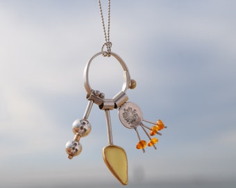 Sea glass necklace with silver and gold elements. Yellow sea glass necklace. Gift for ocean lover. Sunshine pendant necklace. Upcycling