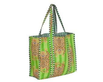 May include: A green and white striped tote bag with a repeating pattern of orange and black tigers. The bag has green handles and a green and white striped interior.