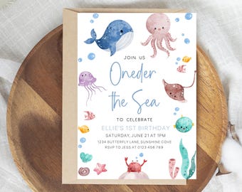 Puede incluir: Una tarjeta de invitación para un primer cumpleaños con una ballena azul y blanca, un pulpo rosa y otras criaturas marinas. El texto dice "Join us Oneder the Sea to celebrate Ellie's 1st Birthday Saturday, June 21 at 1 PM 1234 Butterfly Lane, Sunshine Cove RSVP to Jess at 0123 456 789".