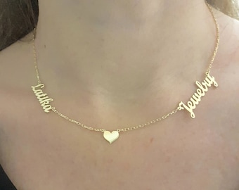 May include: A gold necklace with two names, "Latinka" and "Jewelry", separated by a small heart charm.