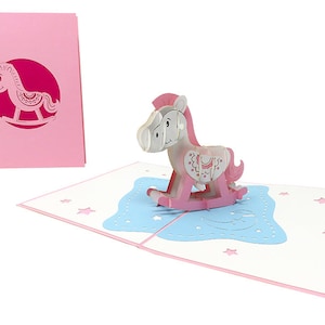 Cavallo a dondolo rosa