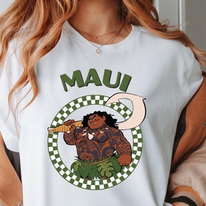 a woman wearing a white shirt with an image of a man holding a gun.


Moana Maui Shirt, Disney Maui Costume