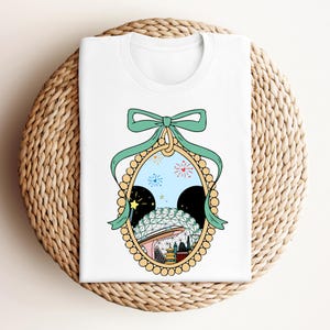 a white t - shirt with a picture of a woman's face in a