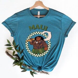 a t - shirt with an image of a man holding a gun