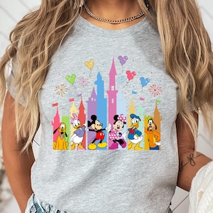 a woman wearing a mickey mouse shirt
