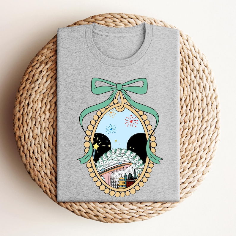 a gray t - shirt with a picture of a woman's face in a