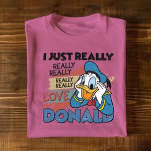 a pink t - shirt with a cartoon character saying i just really really really really