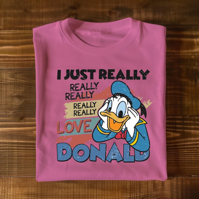 a pink t - shirt with a cartoon character saying i just really really really really
