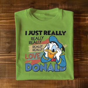 a green t - shirt with a cartoon character saying i just really really really really