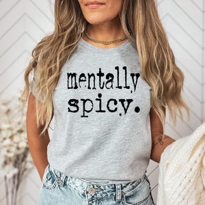 May include: A gray t-shirt with the text "mentally spicy." printed in black.