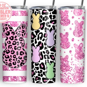 May include: Three 20 oz sublimation tumblers with different designs. The first tumbler has a pink and black leopard print with a pink bunny silhouette. The second tumbler has a white background with a pink and black leopard print and colorful bunny silhouettes. The third tumbler has a white background with pink glitter bunny silhouettes.