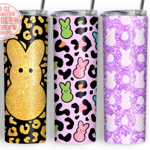 May include: Three 20 oz sublimation tumblers with different designs. The first tumbler has a gold glitter Peeps bunny on a black and gold leopard print background. The second tumbler has a pink, green, and blue Peeps bunny on a pink leopard print background. The third tumbler has a white Peeps bunny on a purple glitter background.