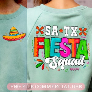May include: A light blue sweatshirt with the text "SA TX Fiesta Squad" in colorful letters with a stitched outline. The text is surrounded by colorful flowers and stars. A small sombrero is in the top left corner.