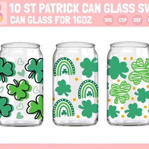 May include: Three 16oz can glass designs featuring St. Patrick's Day themed patterns. The first design has green shamrocks and hearts. The second design has green shamrocks, rainbows, and yellow dots. The third design has green shamrocks with a striped pattern and yellow dots.