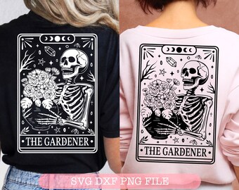 May include: A black and white graphic design of a skeleton holding a bouquet of flowers in a pot. The design is framed in a rectangle with the text "THE GARDENER" at the bottom. The design is on a black t-shirt and a pink t-shirt.