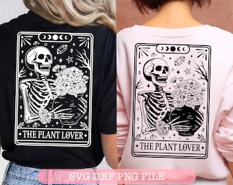 May include: A black and white tarot card design featuring a skeleton holding a pot of flowers. The card reads "The Plant Lover."