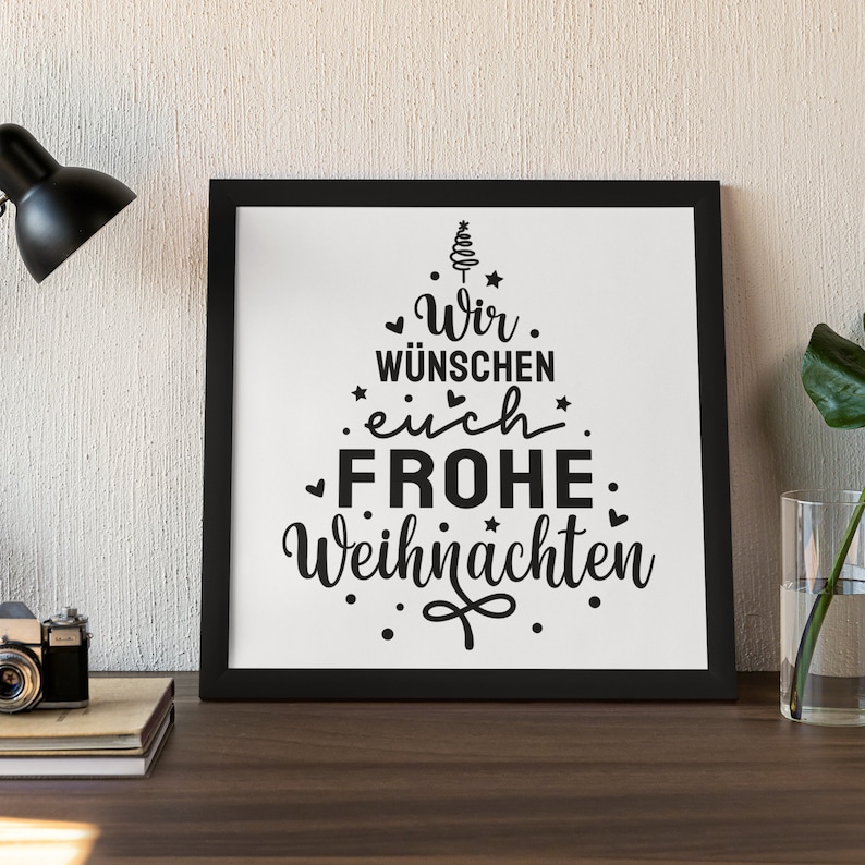 May include: Black and white framed print with a Christmas tree design and the text "Wir w&uuml;nschen euch Frohe Weihnachten".