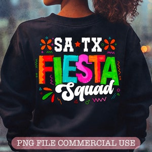 May include: A black sweatshirt with a colorful graphic design that says "SA TX Fiesta Squad".