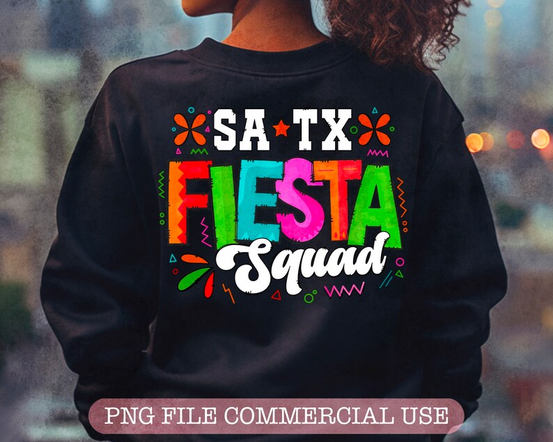 May include: A black sweatshirt with a colorful graphic design that says "SA TX Fiesta Squad".