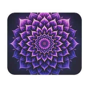 May include: A decorative mousepad featuring a symmetrical floral mandala design. The mandala is rendered in shades of purple and violet, with a dark blue background. The design has a detailed, layered petal pattern.