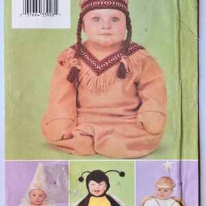 May include: A Butterick 3266 sewing pattern envelope featuring four infant costume designs: a tan fringe outfit with a patterned headband, a pink fairy costume with a cone hat, a black and yellow bumblebee suit, and a white angel costume with wings.