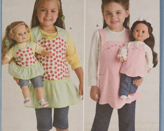 Simplicity 2465.  Child's apron pattern.  Child full cover apron and matching 18" doll apron pattern.  SZ S,M,L (3-8)  Uncut