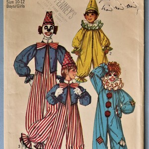 May include: A vintage Simplicity 9051 sewing pattern envelope for children's clown costumes in size 10-12. The illustration features three distinct clown outfits: a yellow jumpsuit with a cone hat, a blue and red striped jumpsuit, and a blue jumpsuit.