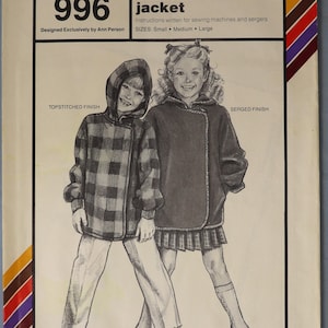 May include: A vintage sewing pattern for a children's stadium jacket. The cover features illustrations of two children wearing the jacket. The pattern is designed by Ann Person and includes sizes small, medium, and large.