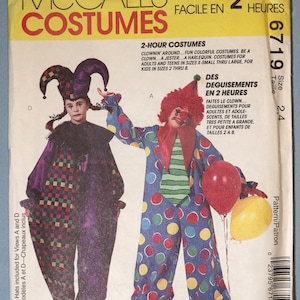 May include: A McCall's sewing pattern envelope for costumes numbered 6719. The front shows two illustrations: a jester in a purple and multicolored checkered jumpsuit with a matching hat, and a clown in a blue jumpsuit with colorful polka dots.