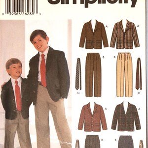 May include: Simplicity sewing pattern 5732 for size K5, covering sizes 7, 8, 10, 12, and 14. The envelope features illustrations of blazers, trousers, and ties, with a photograph showing two models wearing a dark blazer, white shirt, red tie, and trousers.