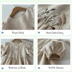 May include: A beige linen dress featuring a round neck, hand-embroidered floral details, two buttons on the back closure, and gathered ruffle sleeves. The garment displays a textured fabric weave and is presented on a wooden hanger.
