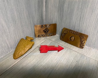 Boy Scout belt buckles & neckerchief slides.