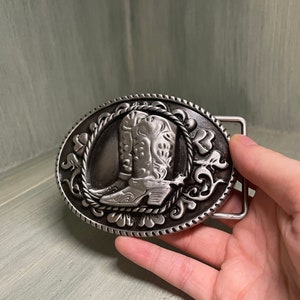 Silver and black cowboy belt buckle