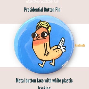 May include: A round, blue Presidential Button Pin with a cartoon illustration of a figure with blonde hair and a peach-colored body. The pin has the text "ICE" on a white wing. The text "Presidential Button Pin" is above the illustration.